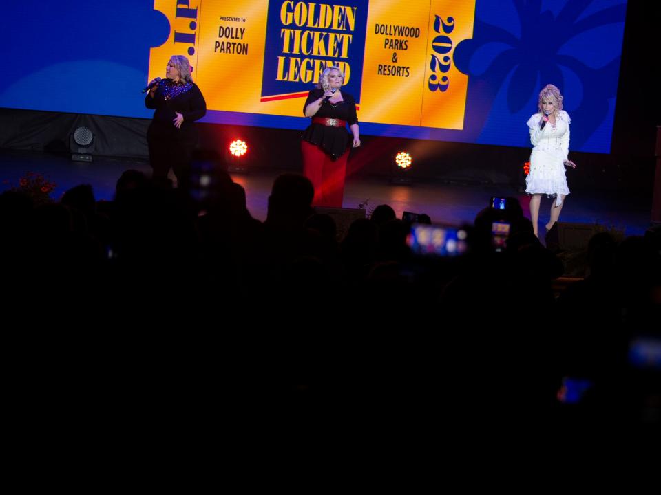 Dolly Parton performs on stage with members of her family during the closing moments of the Golden Ticket Awards ceremony at Dollywood.