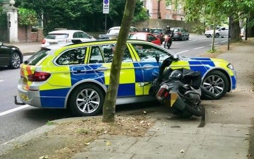 police car used to stop moped-riding thieves from getting away - Metropolitan Police