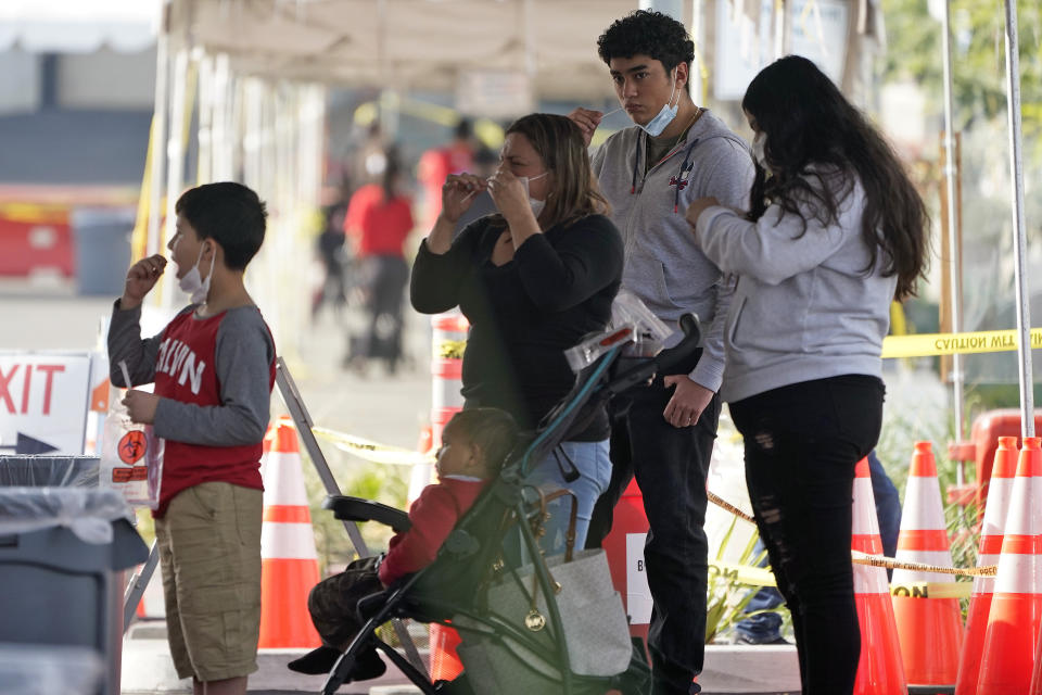 People take a COVID-19 test on the Martin Luther King Jr. Medical Campus, Thursday, Jan. 7, 2021, in Los Angeles. (AP Photo/Marcio Jose Sanchez)