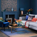 <p> Fireplaces can sometimes stand out for all the wrong reasons. So if you want yours to blend in, paint it to match the walls around it. This is particularly effective if you go for a deep colour rather than a pale neutral. Pick out the tone in soft furnishings but make sure there's enough 'light' to contrast with the shad to avoid overkill. </p>