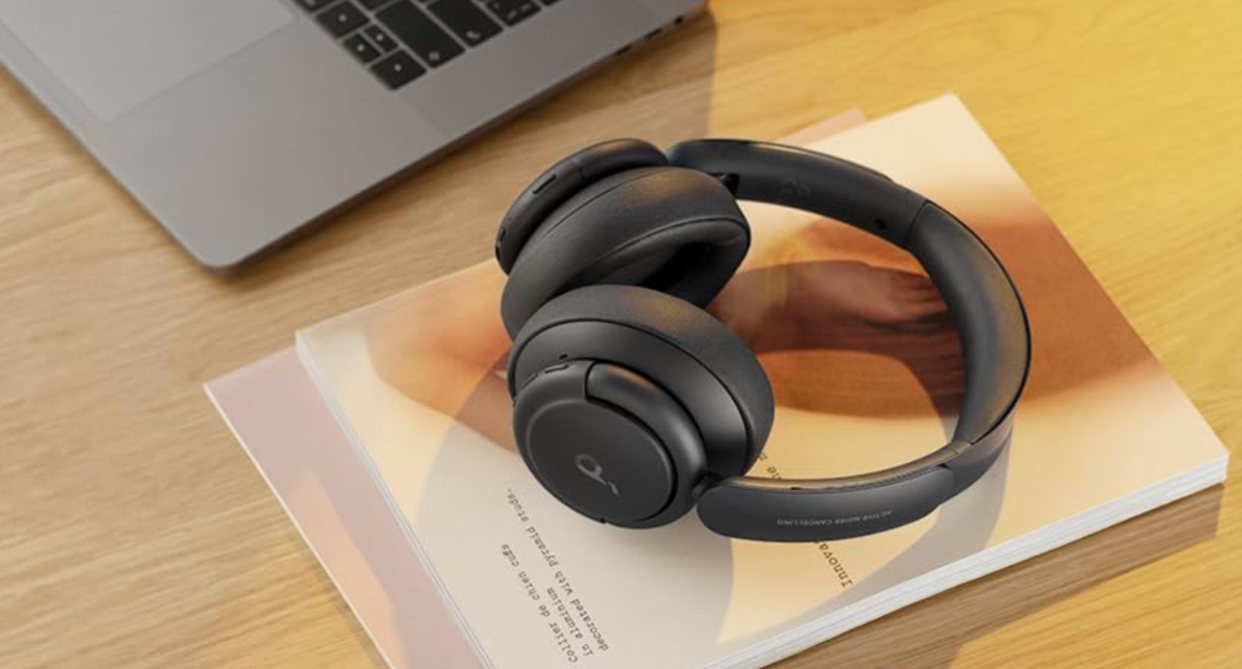 headphones, Soundcore by Anker Life Q35 Noise Cancelling Headphones sitting on paper on desk next to laptop, amazon canada headphones deal 