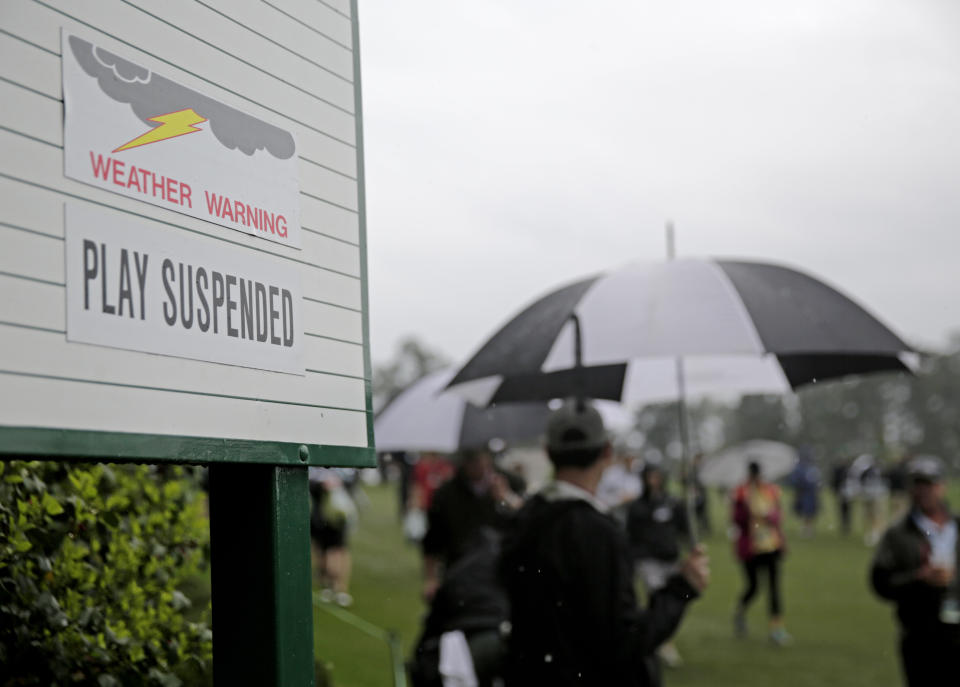 A sign showing play is suspended due to weather is seen during the par three competition at the Masters golf tournament Wednesday, April 5, 2017, in Augusta, Ga. (AP Photo/David Goldman)