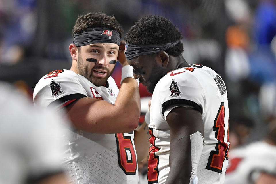 Tampa Bay Buccaneers quarterback Baker Mayfield (6) talks with wide receiver Chris Godwin, right, in the second half of an NFL football game against the Buffalo Bills, Thursday, Oct. 26, 2023, in Orchard Park, N.Y. (AP Photo/Adrian Kraus)