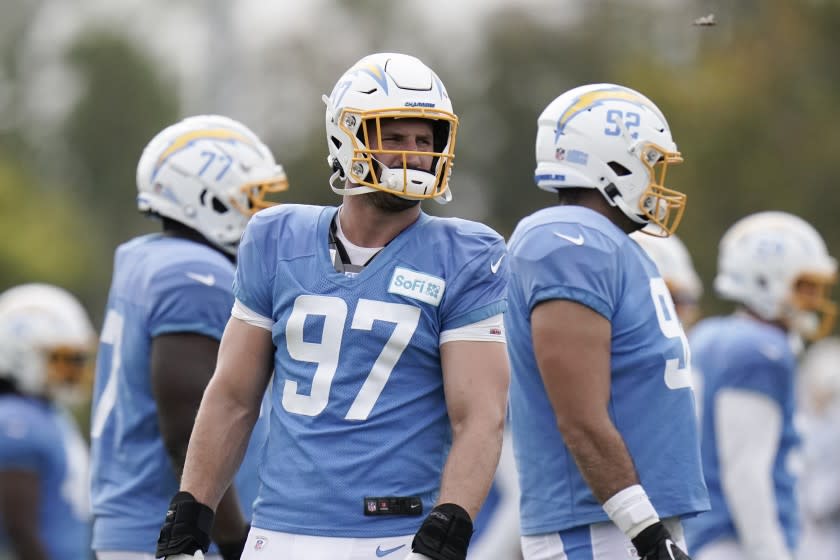 Los Angeles Chargers defensive end Joey Bosa stands on the field during an NFL football camp practice, Monday, Aug. 17, 2020, in Costa Mesa, Calif. (AP Photo/Jae C. Hong)