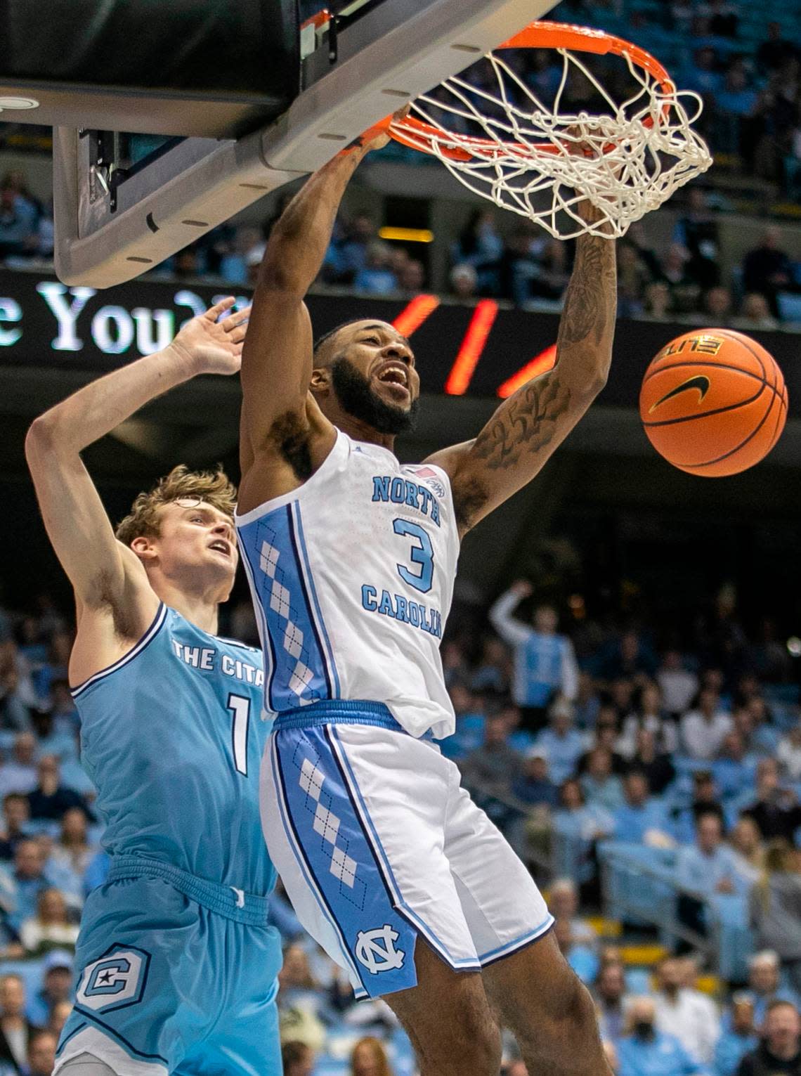 North Carolina’s Dontrez Styles (3) dunks over The Citadel’s Stephen Clark (1) for two of his nine points in the second half on Tuesday, December 13, 2022 at the Smith Center in Chapel Hill, N.C.