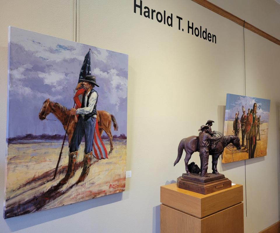 Acrylic paintings by Mike Larsen and a bronze sculpture by the late Harold T. Holden are displayed at JRB Art at the Elms gallery in Oklahoma City's Paseo Arts District Feb. 1, 2024. The exhibit "Cowboys and Indians," featuring works by Oklahoma artists Holden, Larsen and Jack Fowler, is on view through Feb. 29.