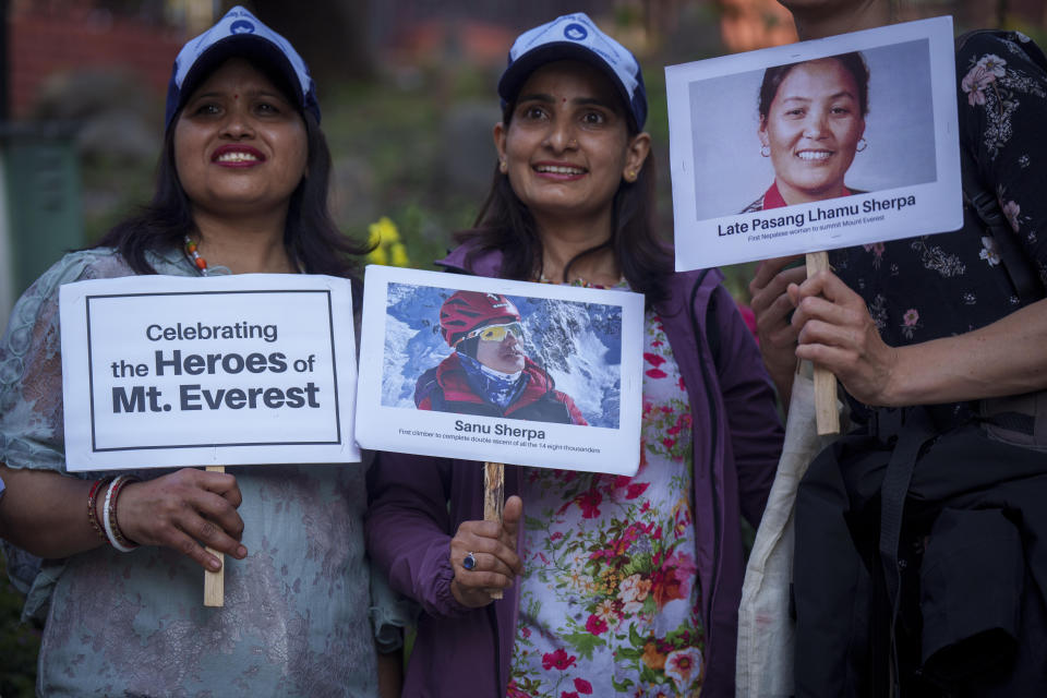 Women hold placards and photos of various record-holding climbers as they mark the 70 anniversary of the first ascent of Mount Everest in Kathmandu, Nepal, Monday, May 29, 2023. The 8,849-meter (29,032-foot) mountain peak was first scaled by New Zealander Edmund Hillary and his Sherpa guide Tenzing Norgay on May 29, 1953. (AP Photo/Niranjan Shrestha)