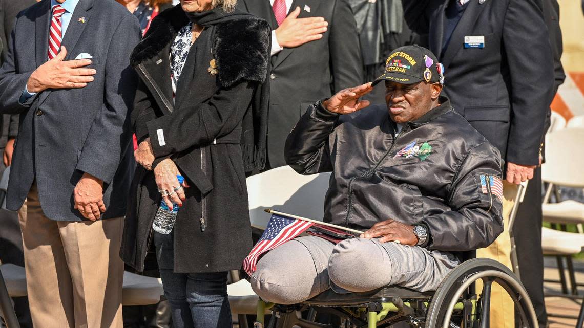 Desert Storm veteran Eddie Caldwell of Coarsegold salutes during the National Anthem prior to the start of the annual Veterans Parade in downtown Fresno on Friday, Nov. 11, 2022. CRAIG KOHLRUSS/ckohlruss@fresnobee.com