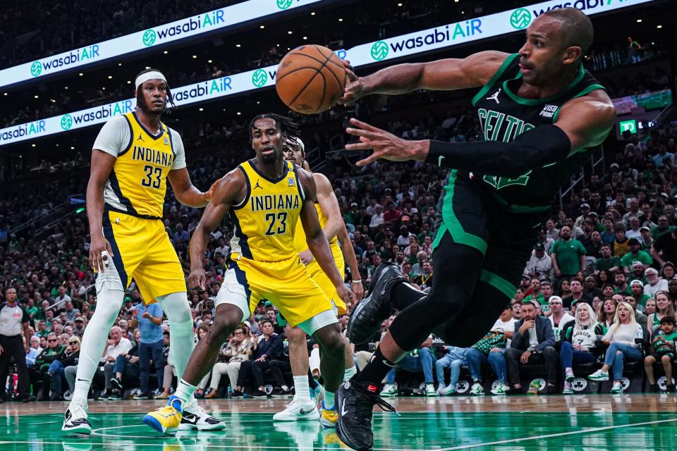 Boston Celtics center Al Horford is fouled by Indiana Pacers forward Aaron Nesmith (23) in the first half of Game 2.