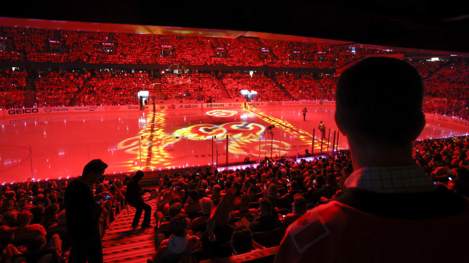 Calgary Flames fans wait for Game 1 of the team's NHL hockey first-round playoff series against the Dallas Stars on Tuesday, May 3, 2022, in Calgary, Alberta. (Jeff McIntosh/The Canadian Press via AP)