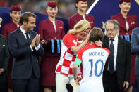 Soccer Football - World Cup - Final - France v Croatia - Luzhniki Stadium, Moscow, Russia - July 15, 2018 Croatia President Kolinda Grabar-Kitarovic speaks with Croatia's Luka Modric while President of France Emmanuel Macron looks on during the presentation REUTERS/Carl Recine