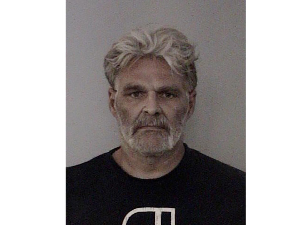 This Wednesday, Oct. 23, 2019, photo released by the El Dorado County Sheriff's Office shows Christopher Garry Ross. Police say three men have been charged in connection with the fatal shooting of a Northern California sheriff's deputy who was killed responding to a falsely reported theft from an illegal marijuana growing operation. Ross, 47, is charged with involuntary manslaughter and remains incarcerated on $50,000 bail, jail records show. The arrests were first reported by The Sacramento Bee. (El Dorado County Sheriff's Office via AP)