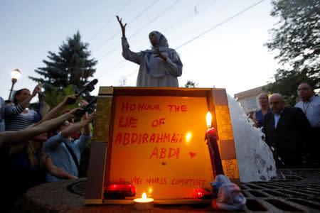 A woman speaks during a vigil for Abdirahman Abdi, a Somali immigrant to Canada who died after being hospitalized in critical condition following his arrest by Canadian police, in Ottawa, Ontario, Canada, July 26, 2016. REUTERS/Chris Wattie