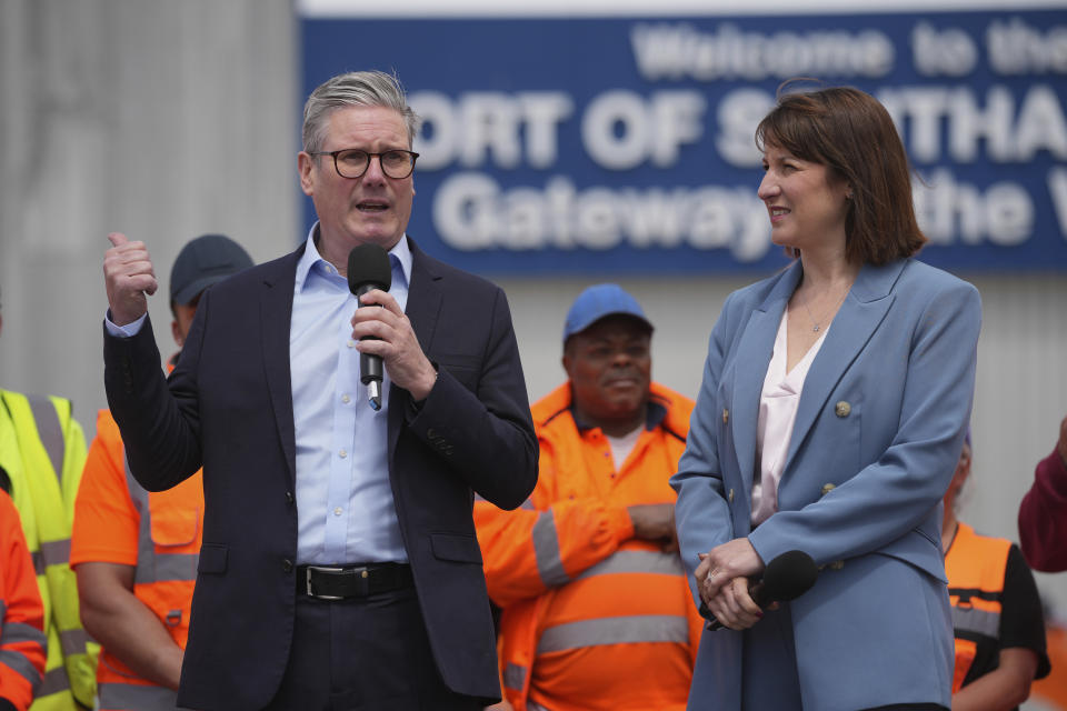 FILE - Britain's Labour Party leader Keir Starmer with shadow chancellor Rachel Reeves speaks during a general election campaign event Southampton Docks in Southampton, England, June 17, 2024. Even in a busy year of elections, the next few days stand out. Voters go to the polls over the next week in fledgling democracies like Mauritania and Mongolia, in the Islamic Republic of Iran and in the stalwart democracies of Britain and France. (AP Photo/Kin Cheung)