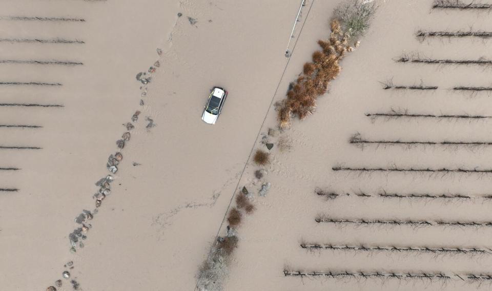 A car is submerged in floodwater after heavy rain moved through the area Jan. 9 in Windsor, Calif.