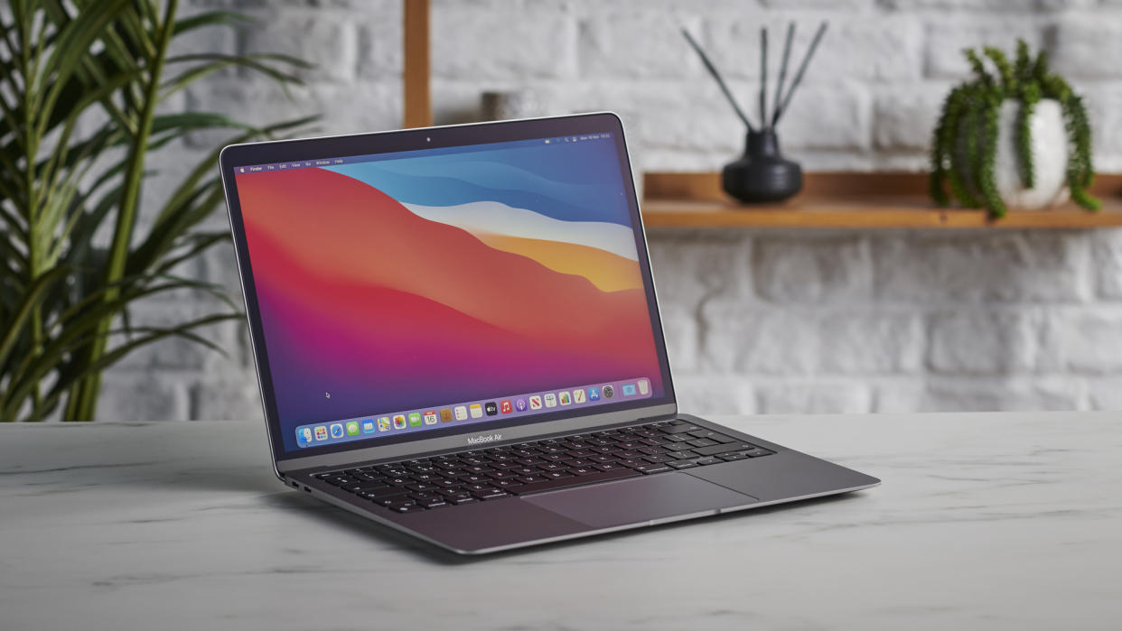  Apple MacBook Air (M1,2020) on a gray surface. 