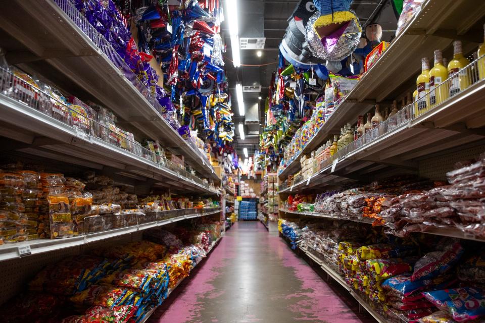 Boxes and bags of Mexican candy line the shelves of Dulceria Importaciones Valentinas in Phoenix on Aug. 24, 2023.