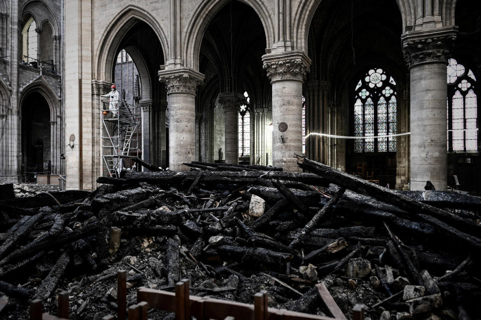 A worker stands on scaffolding during preliminary work inside the Notre Dame de Paris Cathedral, May 15, 2019 in Paris. (Photo: Philippe Lopez/Pool via AP)          