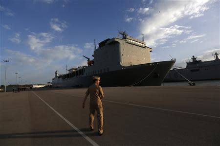 A U.S. navy personnel walks near the U.S. MV Cape Ray ship docked at the naval airbase in Rota, near Cadiz, southern Spain April 10, 2014. REUTERS/Marcelo del Pozo