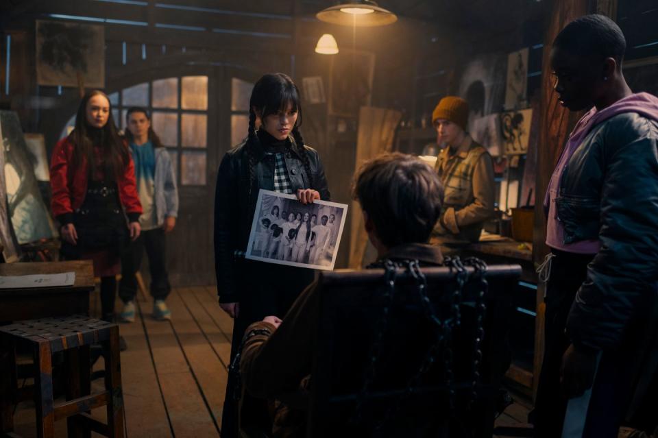 wednesday l to r naomi j ogawa as yoko tanaka, oliver watson as kent, jenna ortega as wednesday addams, hunter doohan as tyler galpin, georgie farmer as ajax petropolus, joy sunday as bianca barclay in episode 108 of wednesday cr vlad ciopleanetflix © 2022