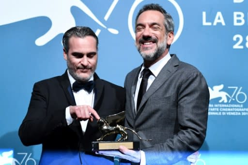 US director Todd Phillips (r) flanked by Joaquin Phoenix whom he described as 'the fiercest and the bravest' actor