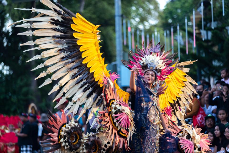 Balinese dancers perform as they take part in a cultural parade (EPA)