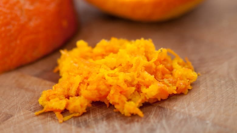 Orange zest on cutting board