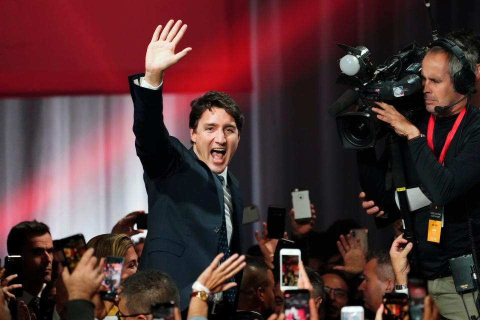 Canada Prime Minister Justin Trudeau waves as he goes on stage at Liberal election headquarters in Montreal, on Monday night.