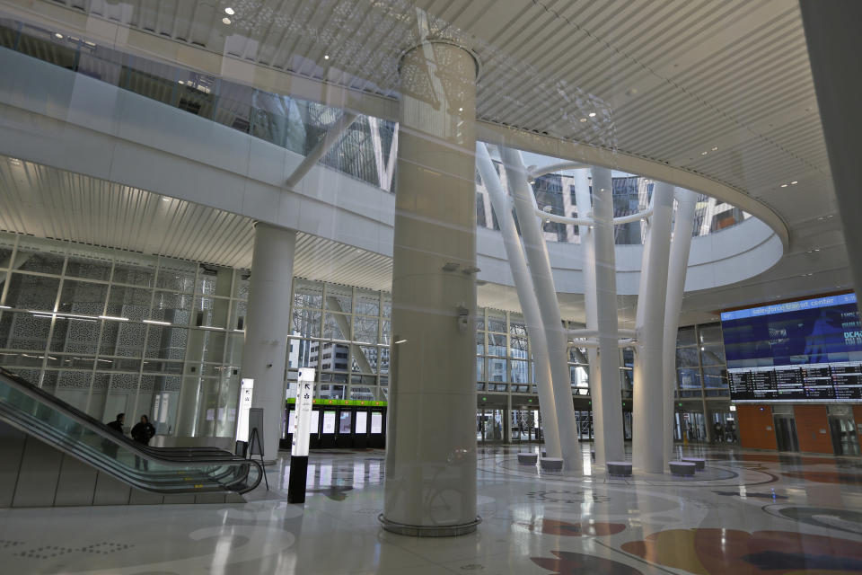 The lower level of the Salesforce Transit Center remains empty except for police, following its closure Tuesday, Sept. 25, 2018, in San Francisco. San Francisco officials shut down the city's celebrated new $2.2 billion transit terminal Tuesday after discovering a crack in a support beam under the center's public roof garden. Coined the "Grand Central of the West," the Salesforce Transit Center opened in August near the heart of downtown after nearly a decade of construction. It was expected to accommodate 100,000 passengers each weekday, and up to 45 million people a year. (AP Photo/Eric Risberg)
