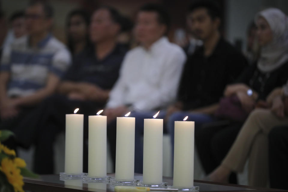 Friends and family of victims from Malaysia Airlines Flight MH17 plane crash attend a ceremony marking the fifth anniversary of the tragedy in Kuala Lumpur, Malaysia, Wednesday, July 17, 2019. Five years after a missile blew Malaysia Airlines Flight 17 out of the sky above eastern Ukraine, relatives and friends of those killed gathered Wednesday in Kuala Lumpur and at a Dutch memorial to mark the anniversary. (AP Photo/Vincent Thian)