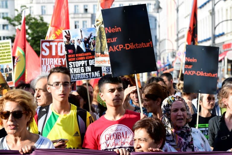 Members of Berlin's Turkish and Kurdish community march to protest against the military coup in Turkey on July 22