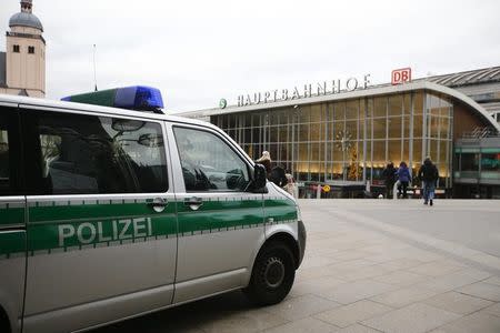 A police vehicle patrols at the main square and in front of the central railway station in Cologne, Germany, January 5, 2016. REUTERS/Wolfgang Rattay