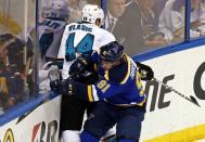 May 17, 2016; St. Louis, MO, USA; San Jose Sharks defenseman Marc-Edouard Vlasic (44) is checked by St. Louis Blues right wing Vladimir Tarasenko (91) along the boards during the second period in game two of the Western Conference Final of the 2016 Stanley Cup Playoff at Scottrade Center. Mandatory Credit: Aaron Doster-USA TODAY Sports