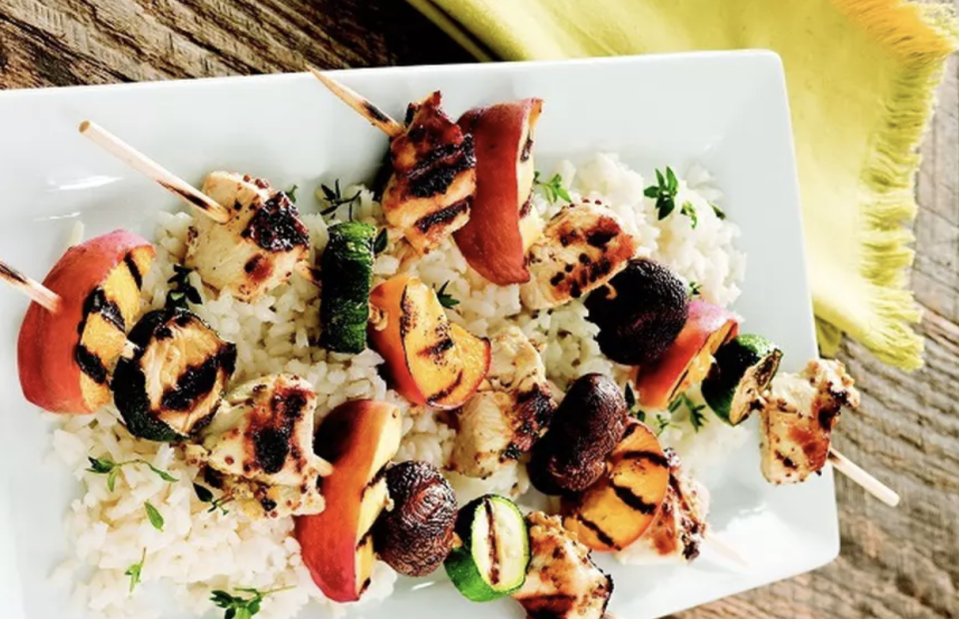 <p>Peaches are sweet, juicy and hold up extremely well on the grill, making this dish perfect for warmer days. For a sweet and savory spin on kabobs, alternately skewer chunks of peaches, zucchini rounds and small pieces of marinated chicken and cook on the grill. </p> <p><a href="https://www.thedailymeal.com/best-recipes/grilled-chicken-peach-skewers?referrer=yahoo&category=beauty_food&include_utm=1&utm_medium=referral&utm_source=yahoo&utm_campaign=feed" rel="nofollow noopener" target="_blank" data-ylk="slk:For the Grilled Chicken and Peach Kabobs recipe, click here.;elm:context_link;itc:0;sec:content-canvas" class="link ">For the Grilled Chicken and Peach Kabobs recipe, click here.</a></p>