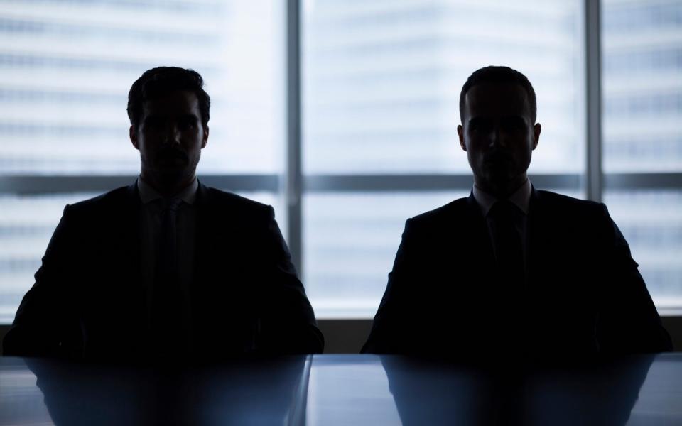 Two businessmen in a job interview meeting room