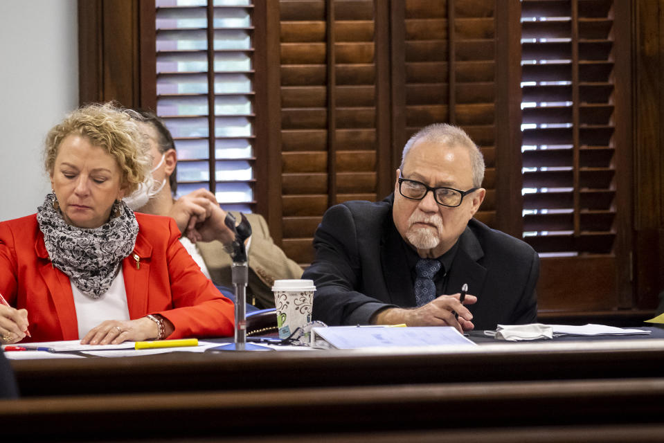 Greg McMichael. right, listens to attorneys question a pool of prospective jurors during jury selection for the trial of he and his son Travis McMichael and William "Roddie" Bryan, at the Glynn County Courthouse, Monday, Oct. 25, 2021, in Brunswick, Ga. The trio are charged with the slaying of 25-year-old Ahmaud Arbery in February 2020. (AP Photo/Stephen B. Morton, Pool)