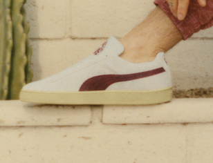 A closer look at the Puma x Palm Tree Crew suede sneakers in "Vapor Gray-Club Red"