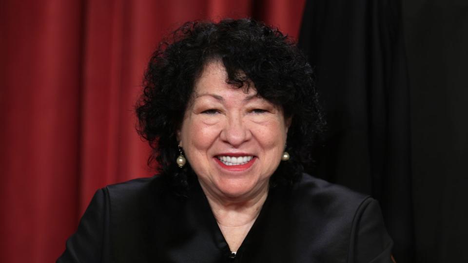 sonia sotomayor wearing her supreme court clothing and smiling for a photograph