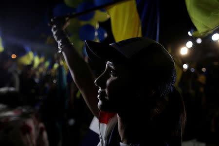 A supporter of Fabricio Alvarado Munoz, presidential candidate of the National Restoration party (PRN), reacts after the first official presidential election results were released, in San Jose, Costa Rica, April 1, 2018. REUTERS/Juan Carlos Ulate?