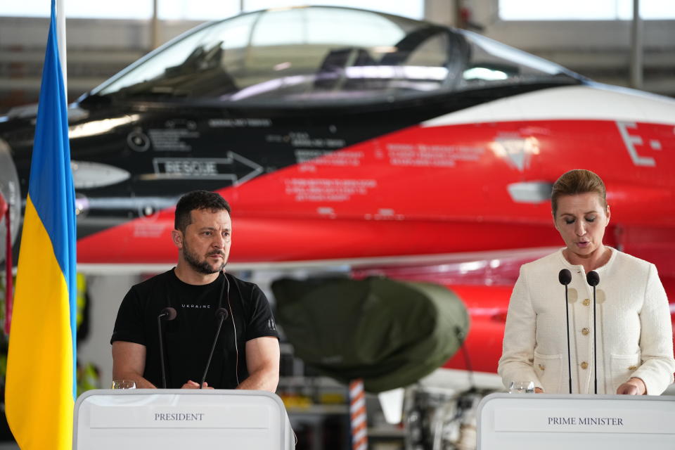 Ukrainian President Volodymyr Zelenskyy, left and Denmark's Prime Minister Mette Frederiksen hold a press conference, at Skrydstrup Airbase, in Vojens, Denmark, Sunday, Aug. 20, 2023. Denmark’s prime minister says it will donate 19 F-16 fighter jets to Ukraine. It follows a similar offer earlier from the Netherlands Ukrainian President Volodymyr Zelenskyy called an important motivation for his country’s forces, who are embroiled in a difficult counteroffensive against Russia. (Mads Claus Rasmussen/Ritzau Scanpix via AP)