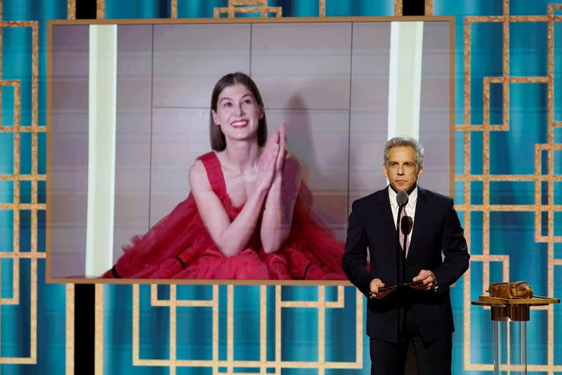 Rosamund Pike accepts the Best Actress - Motion Picture - Musical/Comedy award for "I Care a Lot" in this handout photo from the 78th Annual Golden Globe Awards in New York