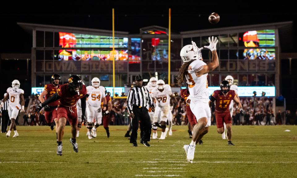 Texas receiver Jordan Whittington hauls in a 23-yard touchdown pass from Quinn Ewers in the third quarter of the Longhorns' 26-16 win over Iowa State at Jack Trice Stadium in Ames, Iowa. Whittington added a 2-point shovel pass.