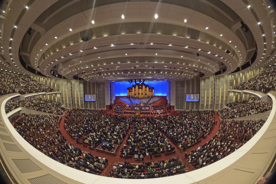This image made with a fisheye lens shows people attending the twice-annual conference of the Church of Jesus Christ of Latter-day Saints, Sunday, April 7, 2024, in Salt Lake City. (AP Photo/Rick Bowmer)