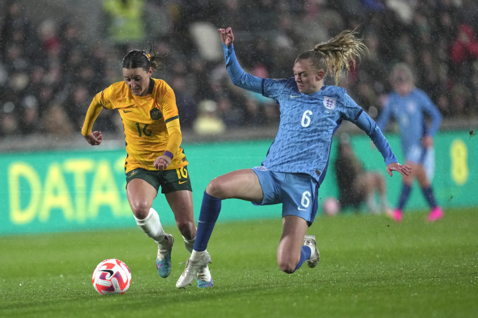 England's Esme Morgan, right, and Australia's Hayley Raso fight for the ball during the women's international friendly soccer match between England and Australia at the Gtech Community Stadium in London, England, Tuesday, April 11, 2023. (AP Photo/Kin Cheung)