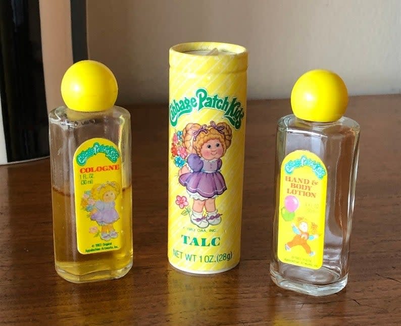 A bottle of Cabbage Patch Kids' cologne, talc, and a hand and body lotion