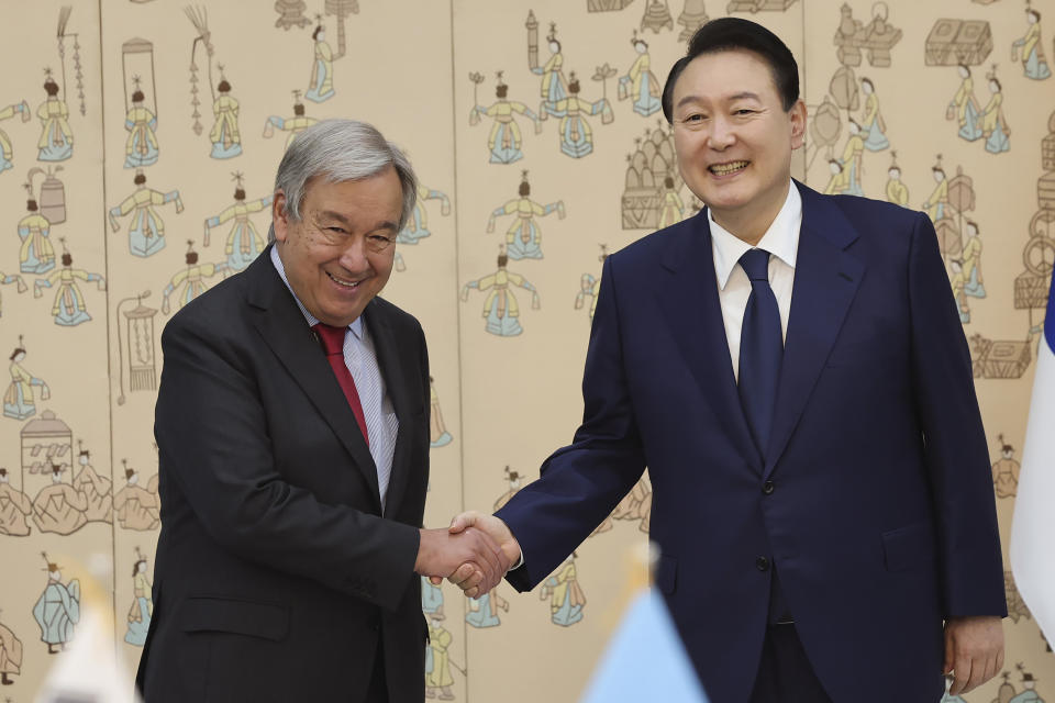 South Korean President Yoon Suk Yeol, right, shakes hands with Secretary-General of the United Nations Antonio Guterres during a meeting at the presidential office in Seoul, South Korea, Friday, Aug. 12, 2022. (Suh Myung-geon/Yonhap via AP)