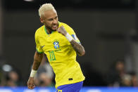 Brazil's Neymar celebrates after scoring his side's second goal from the penalty spot during the World Cup round of 16 soccer match between Brazil and South Korea, at the Education City Stadium in Al Rayyan, Qatar, Monday, Dec. 5, 2022. (AP Photo/Martin Meissner)