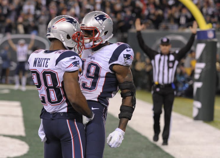 James White (28) and Malcolm MItchell celebrate a touchdown. (AP)