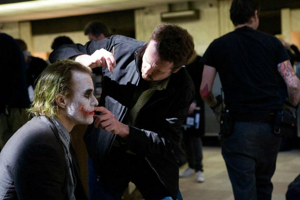 Heath Ledger receiving a touch-up on the set of 'The Dark Knight', 2008