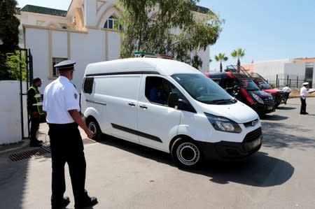 Men, accused in the killing of a Danish and Norwegian hikers in the Atlas mountains near Marrakech last December, are seen inside a car after leaving the courtroom in Sale